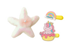 Decorative items including a starfish-shaped ornament, a hair clip with a unicorn design, and a small rainbow object on a white background.