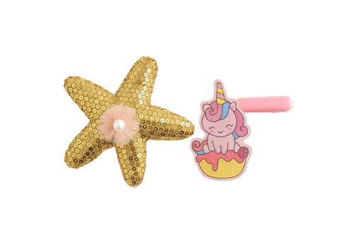 Gold starfish-shaped hair clip with pink center and unicorn-themed hair clip on a white background with yellow dots.
