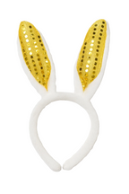 White headband with gold sequin bunny ears on a white background