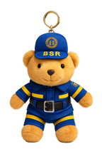 Teddy bear keychain in blue uniform with 'BSR' on a white background
