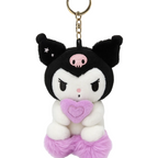 Plush keychain with black and white design and pink heart, on a white background