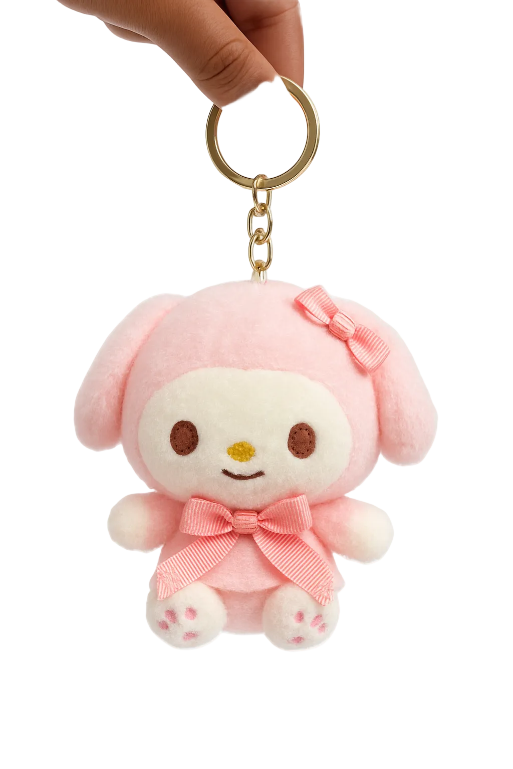 Pink plush keychain with a bow held by a hand on a white background