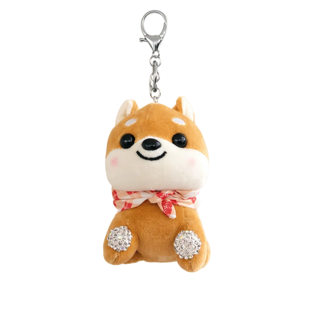 Plush dog-shaped keychain with a bow tie on a neutral background