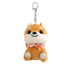 Plush dog-shaped keychain with a bow tie on a neutral background