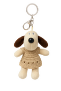 Plush dog keychain with a dress on a white background
