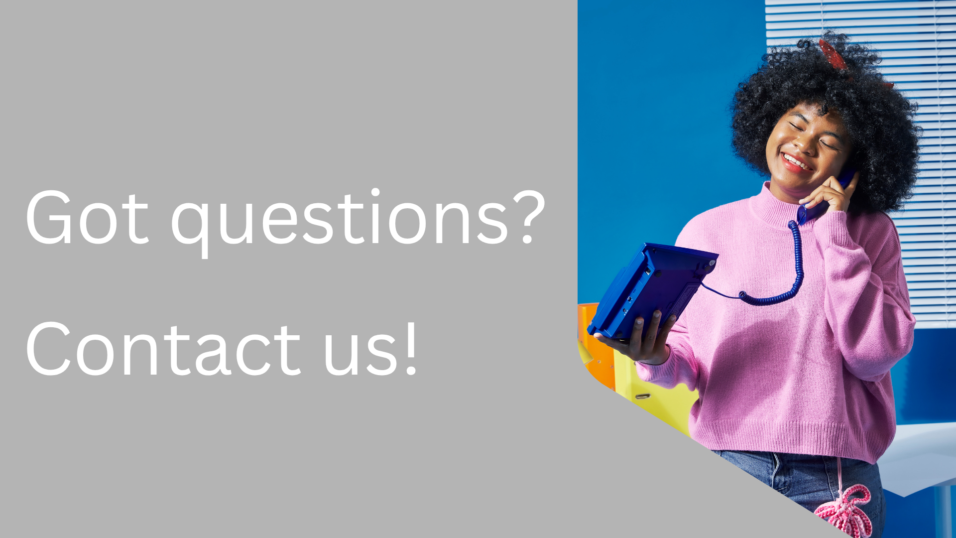 Person in pink sweater holding a phone and tablet with text 'Got questions? Contact us!' on a gray background