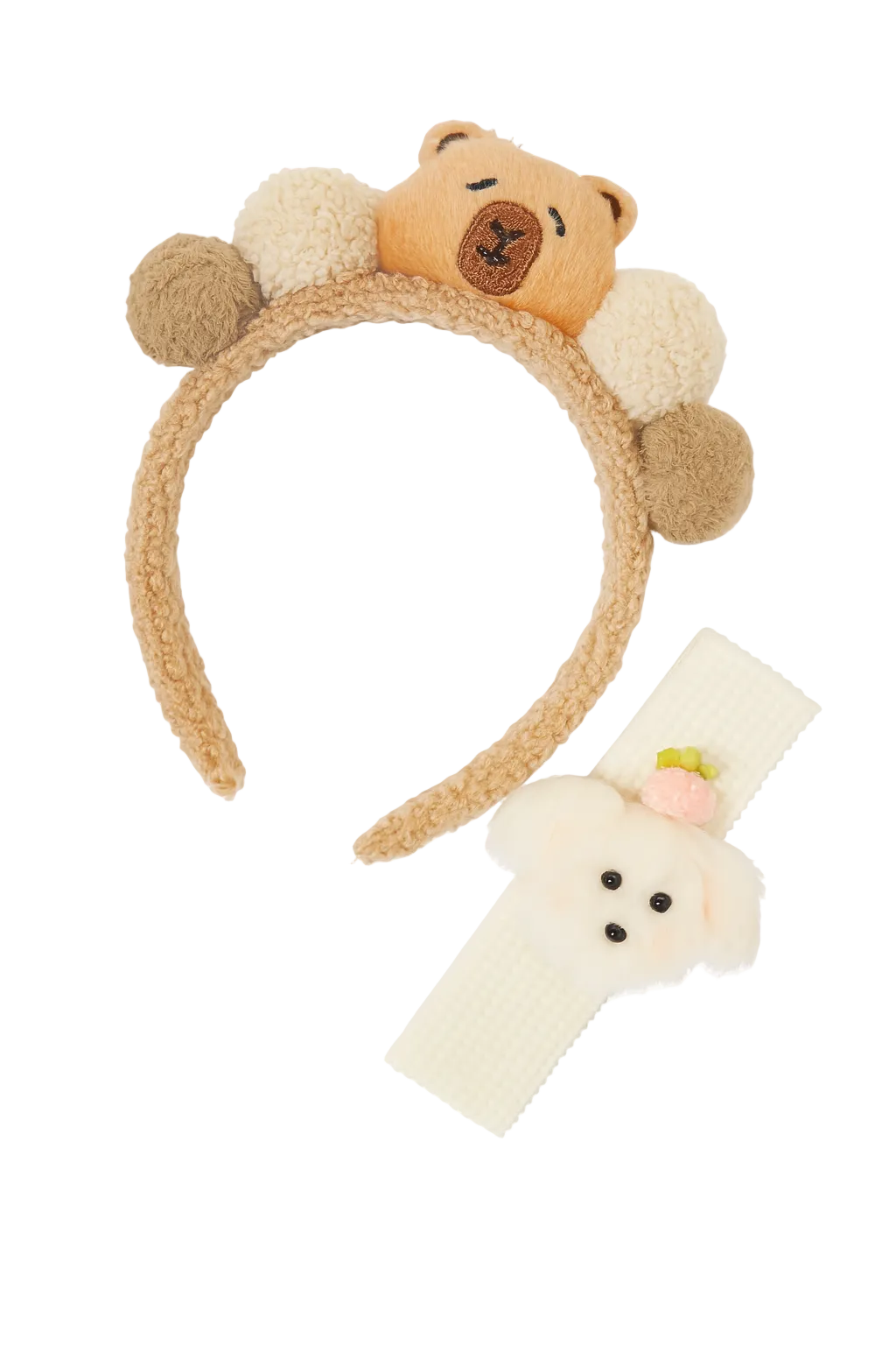 Bear-themed headbands with pom-poms on a white background
