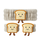 Plush toys shaped like slices of bread with smiling faces on a white background