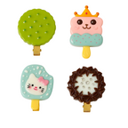 Set of four colorful clip-on accessories shaped like ice cream cones, a crown, a cat, and a wreath on a white background.
