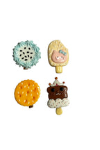 Four colorful ice cream cone figurines on a white background