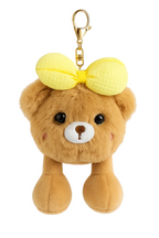 Plush bear keychain with a yellow bow on a white background