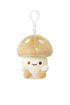 Plush mushroom charm with a smiling face on a white background