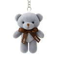 Gray teddy bear keychain with a brown ribbon and 'LOVE' tag on a white background
