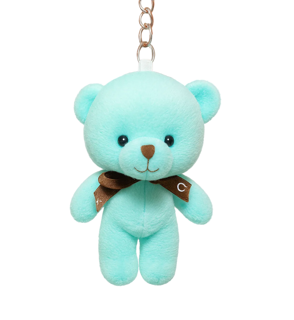 Light blue teddy bear keychain held by a hand on a white background