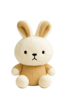 Stuffed animal toy with rabbit-like features on a white background
