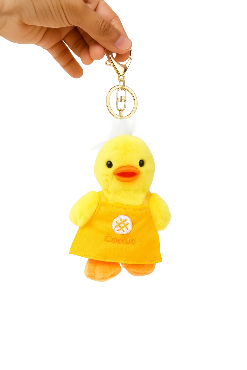 Yellow rubber duck keychain held by a hand on a white background