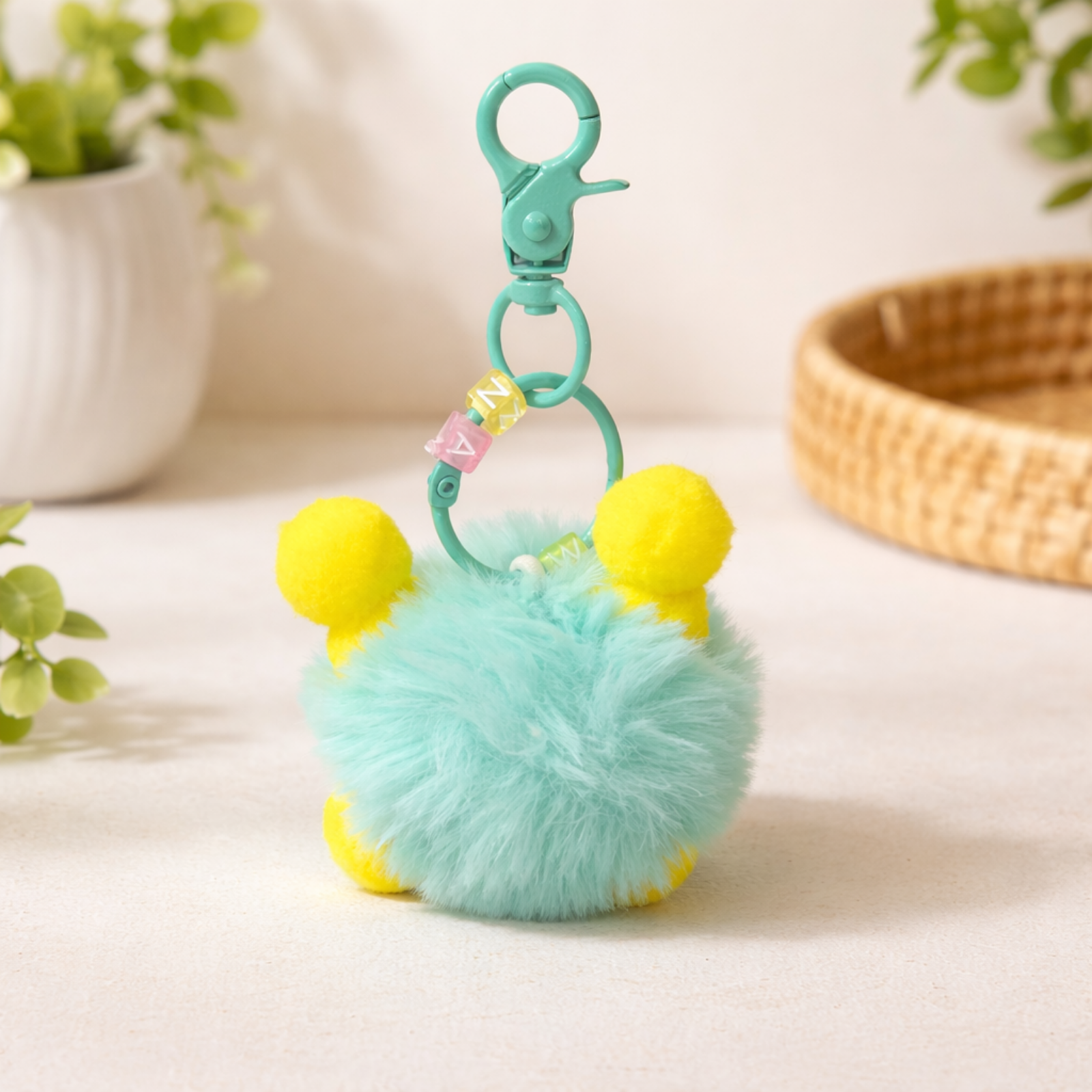 Turquoise Fluffy Monster Keychain with Yellow Ears & Funky Face