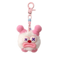 Small plush keychain with a sad face design on a neutral background